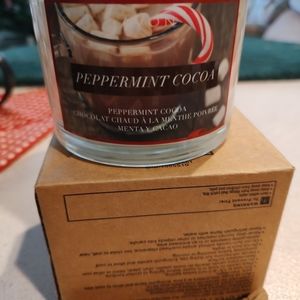 Enjoy the warm and cozy feeling with this Avon Peppermint Cocoa Scented Candle.